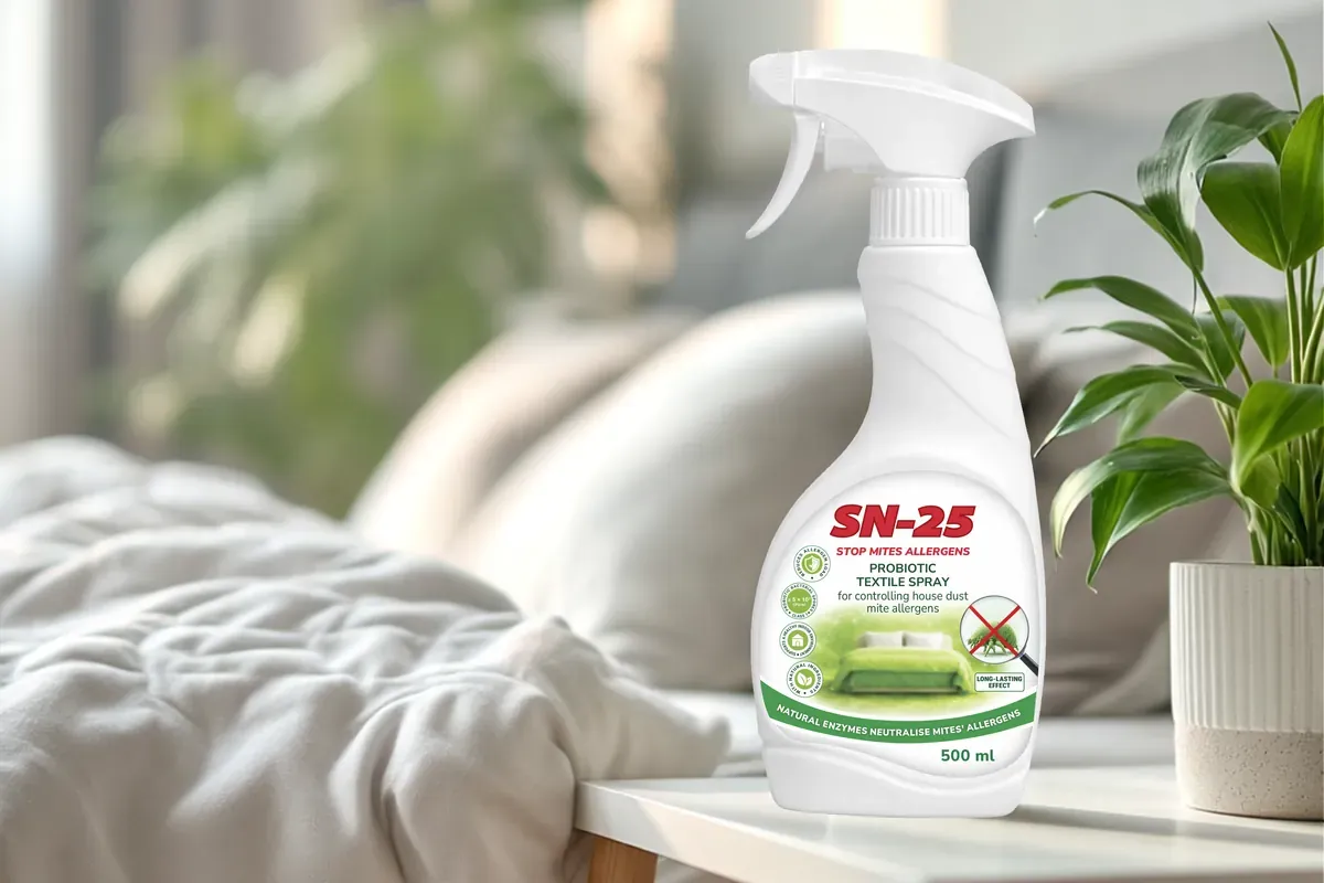 SN-25 dust mite spray bottle placed on a bedside table